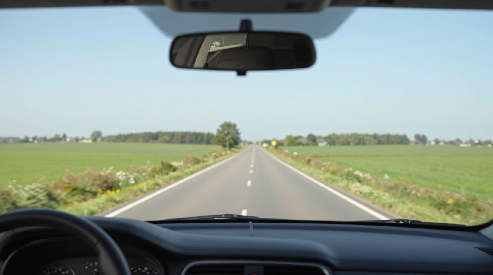 Dashboard en voorruit tijdens rijles